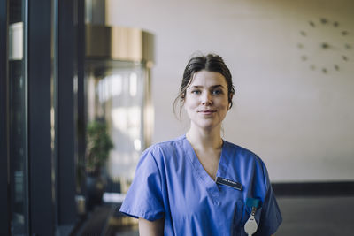 Portrait of confident female doctor in hospital