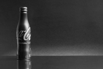 Close-up of glass bottle on table