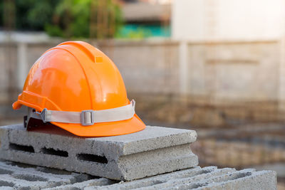 Close-up of orange hat on construction site