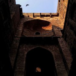 Low angle view of old ruin building against sky