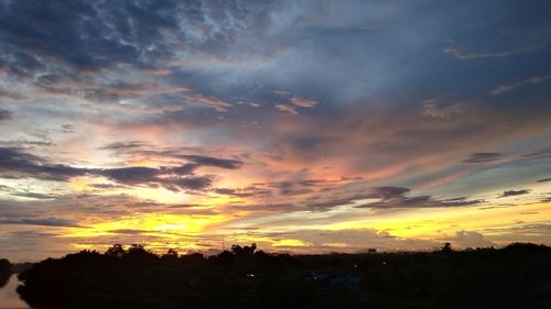 Low angle view of dramatic sky during sunset