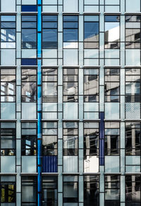 Full frame shot of modern office building with reflection