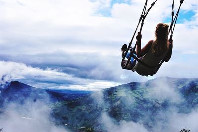 Low angle view of swing against sky