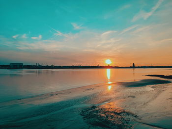 Scenic view of sea against sky during sunset