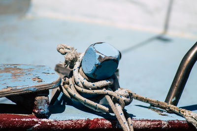 Close-up of rope tied up on metal boat