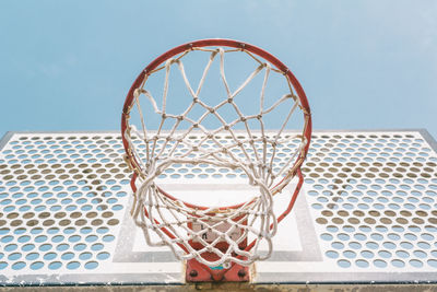 Low angle view of basketball hoop against sky