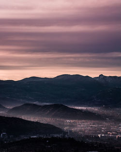 Scenic view of mountains against dramatic sky