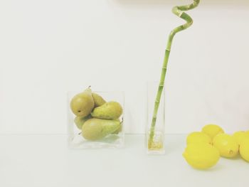Close-up of fruit over white background