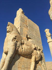 Low-angle view of the statue against clear sky