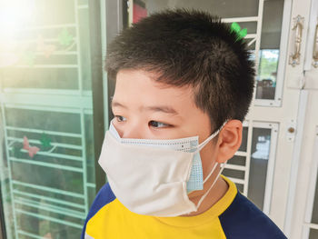 Portrait of boy in window