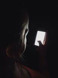 Woman looking through window