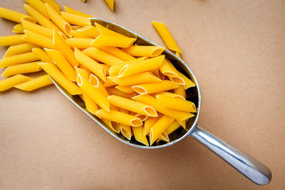 High angle view of yellow drink on table