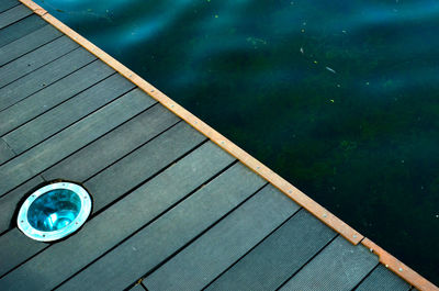 High angle view of swimming pool against lake