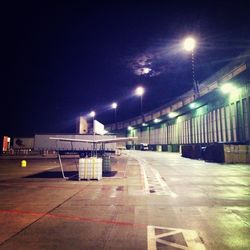 Empty illuminated street at night