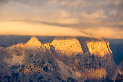 Panoramic sunset view of rocky mountain ridges, iof di montasio / montaz group