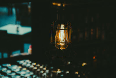 Close-up of illuminated light bulb at night