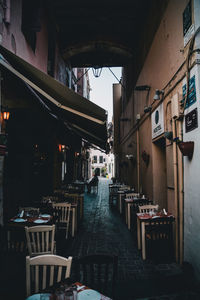 Empty alley amidst buildings in city