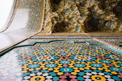 Multi colored umbrellas on tiled floor in building