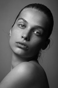 Fashion portrait of a young woman in black and white