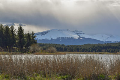 Scenic view of snowcapped mountains against sky