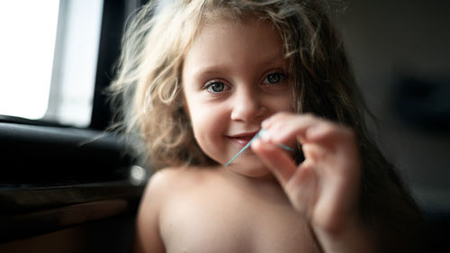 Portrait of cute baby girl at home