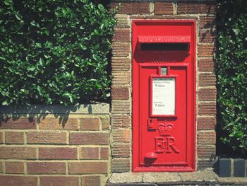 Close-up of red mailbox on tree