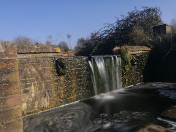 Close-up of fountain against clear sky