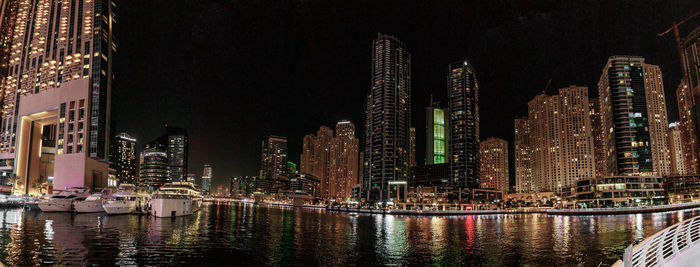 Illuminated buildings in city at night