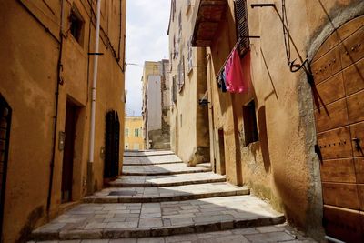 Narrow alley amidst buildings in city