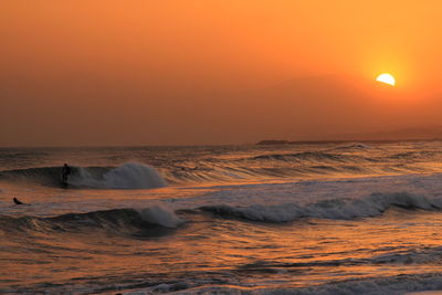 Scenic view of sea at sunset