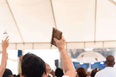 Rear view of woman holding map