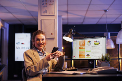 Portrait of young businesswoman working in office