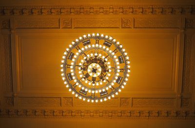 Low angle view of illuminated chandelier