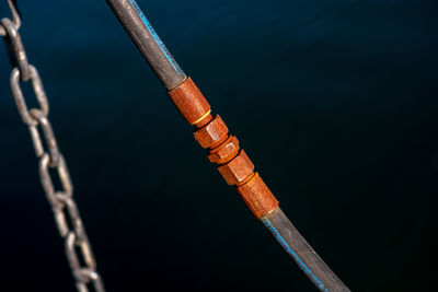 High angle view of rope tied on metal