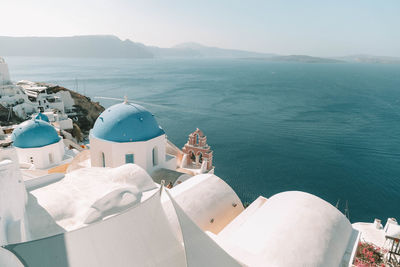 High angle view of temple by sea against sky