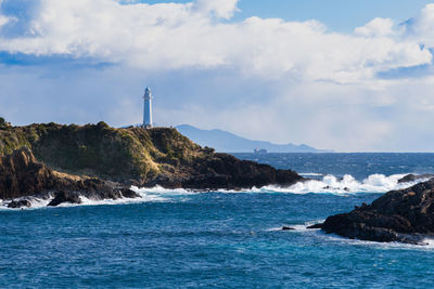 This scene of the tsumekizaki lighthouse caught my eye as it shows a cargo ship sailing out to sea. 