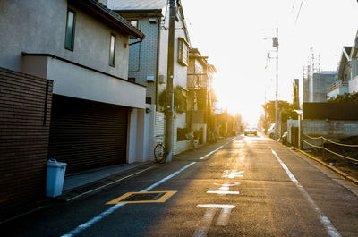 Vehicles on road along buildings