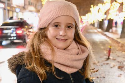 Portrait of smiling girl wearing hat during winter