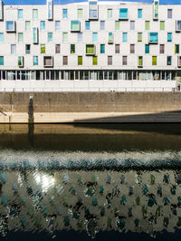 High angle view of swimming pool by buildings in city