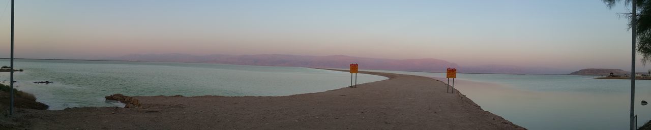 Scenic view of beach against sky during sunset