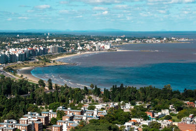 High angle view of townscape by sea