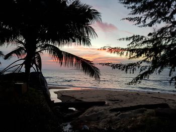 Scenic view of beach against sky during sunset