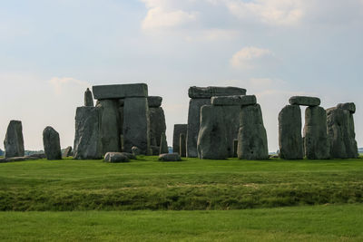 Built structure on field against sky