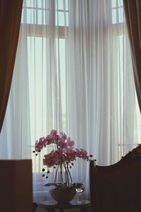 Flower vase on table at home