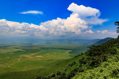 Scenic view of landscape against blue sky