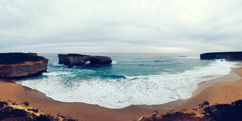 Scenic view of sea against cloudy sky