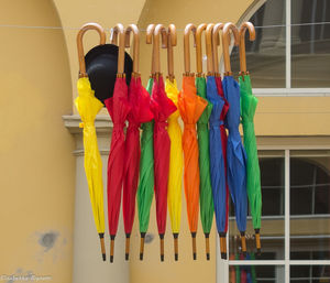 Close-up of multi colored flags hanging on rack