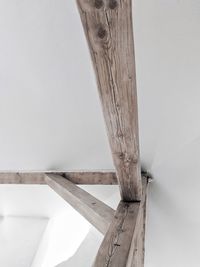 High angle view of wooden table against wall