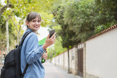 Young woman using mobile phone