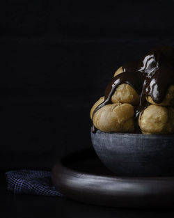 Profiteroles ,fresh choux pastry covered in a rich chocolate sauce